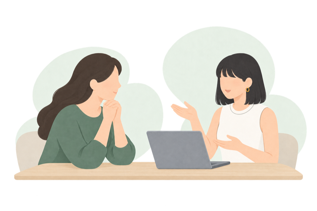 保護者と相談員が、机を囲んで現在の状況について話している様子